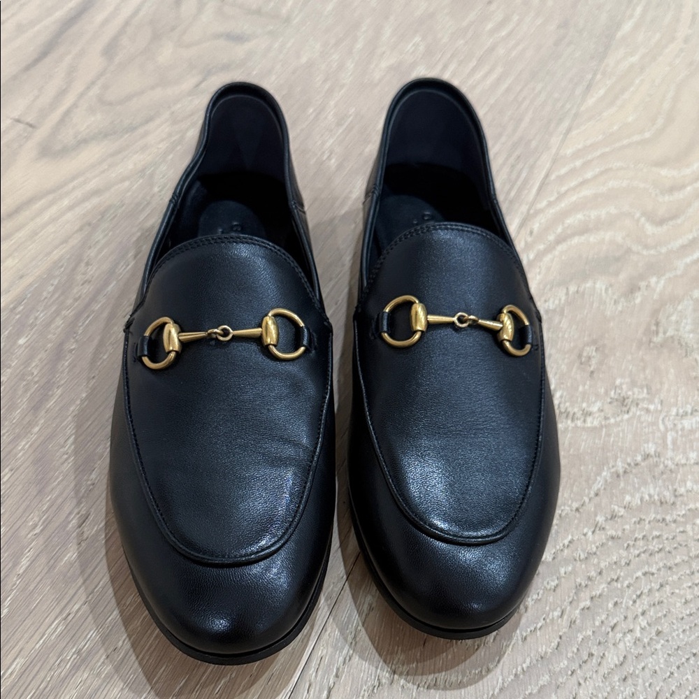 Pre loved authentic Black Leather Loafers with Gold Detail